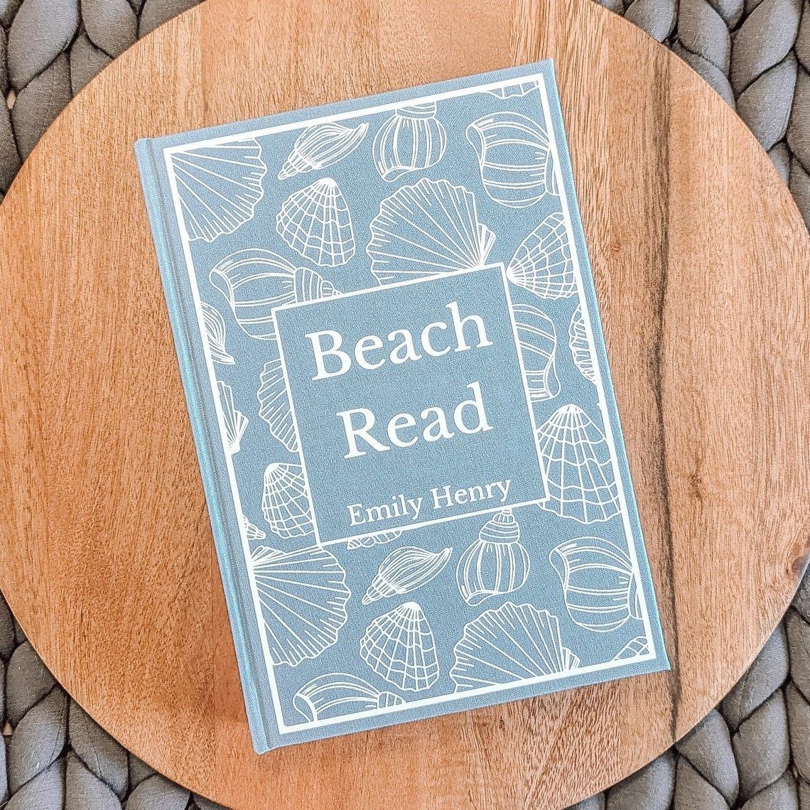 Beach Read by Emily Henry with a custom, blue, seashell cover