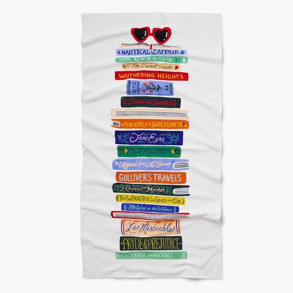 Beach towel with book spines on it on