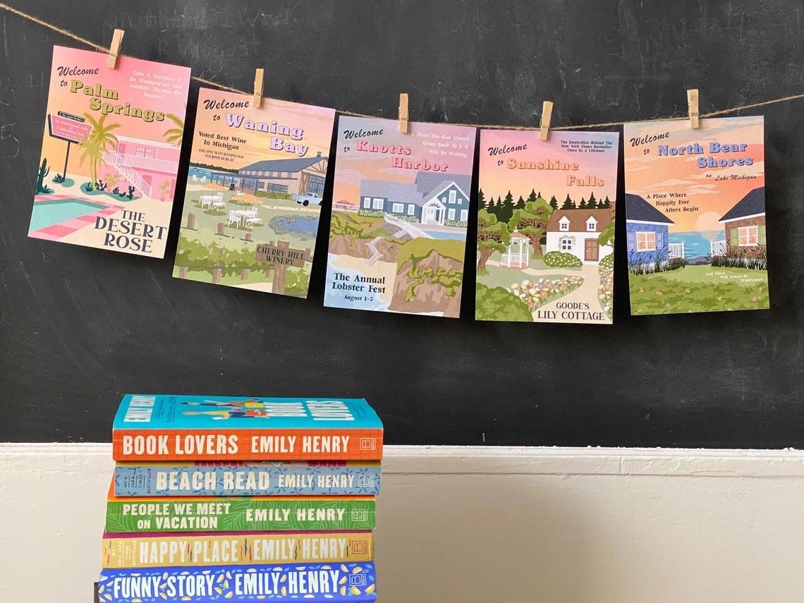 Posters with scenes from Emily Henry books on a clothesline
