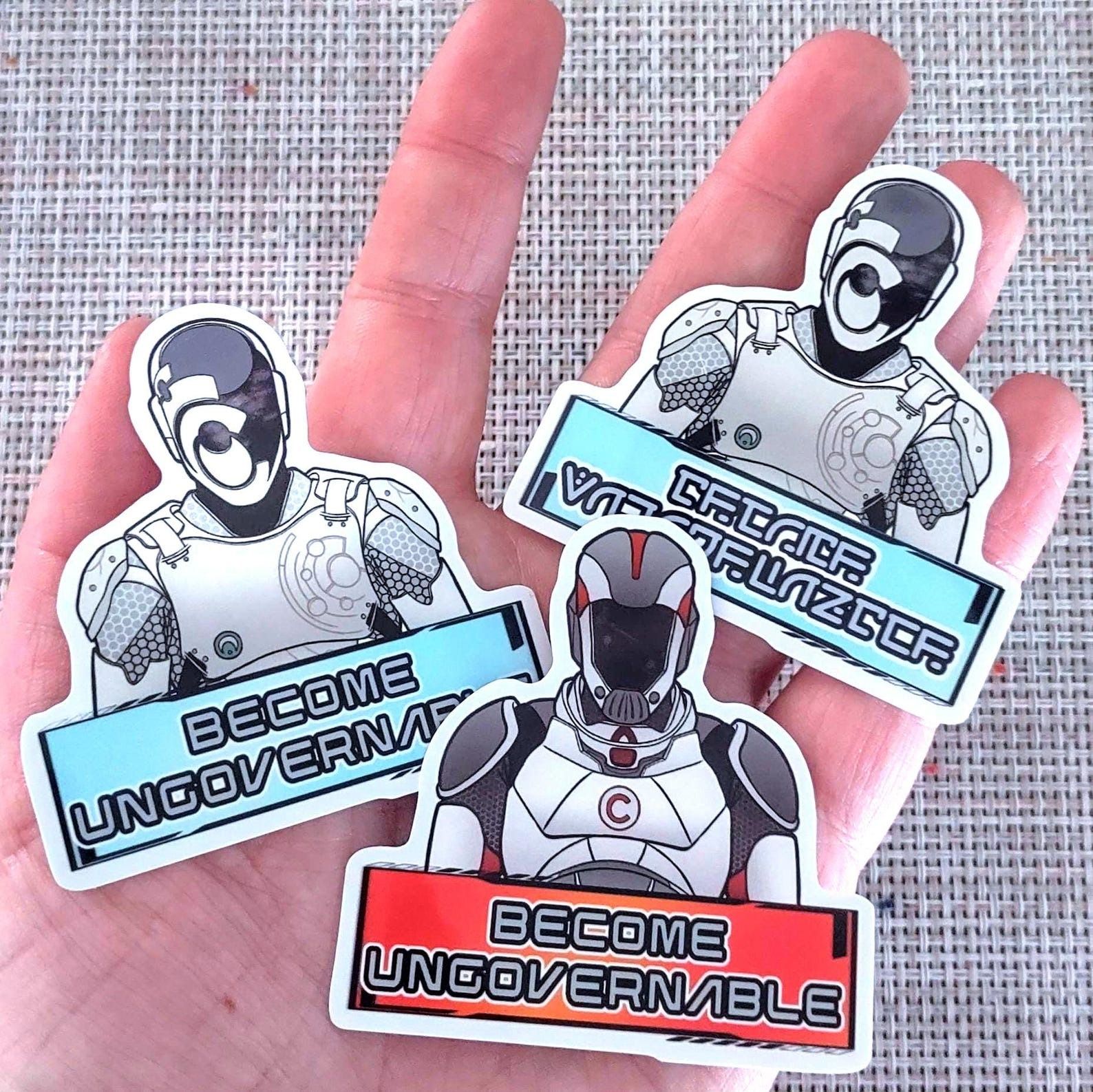 Murderbot stickers with the text Become Ungovernable