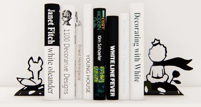 metal bookends of the silhouettes of The Little Prince and his fox