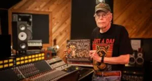 Stephen King holds his Hansel and Gretel book retelling in a sound studio