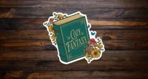 sticker of a green hardcover book with Cozy Fantasy text on cover
