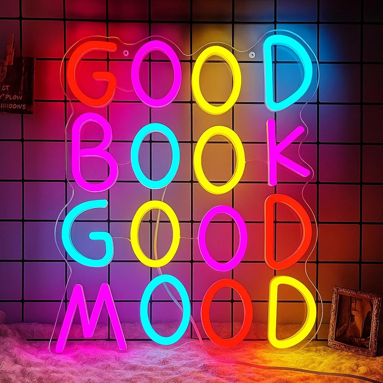 Image of a colorful neon sign with the words "good book good mood."
