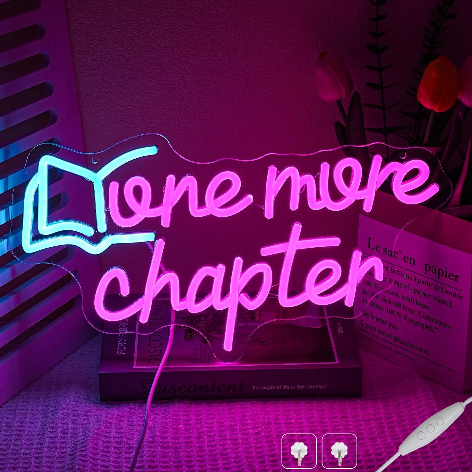 Image of a neon sign that says "one more chapter."