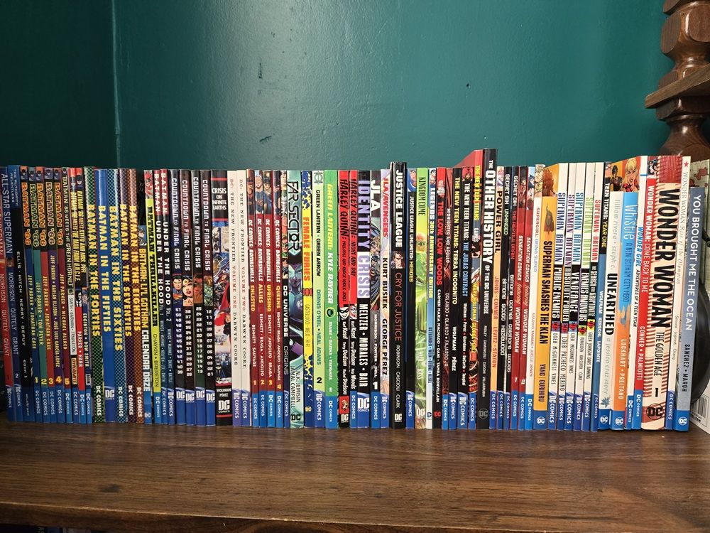 Author photo of a bookshelf of DC comics
