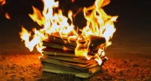 a stack of books on fire
