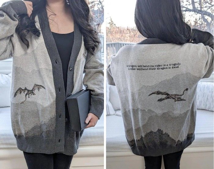 a cardigan with a dragon flying over mountains and the text "A dragon without its rider is a tragedy. A rider without their dragon is dead."