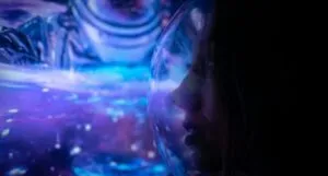 Woman in a Space Helmet Illuminated in Blue