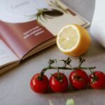 cooking ingredients near a cookbook on a counter