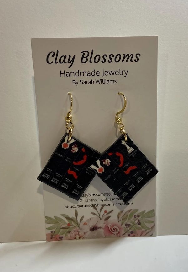 set of Twilight book-cover earrings with gold hardware