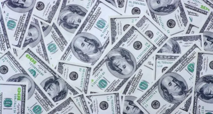 collage of hundred dollar bills