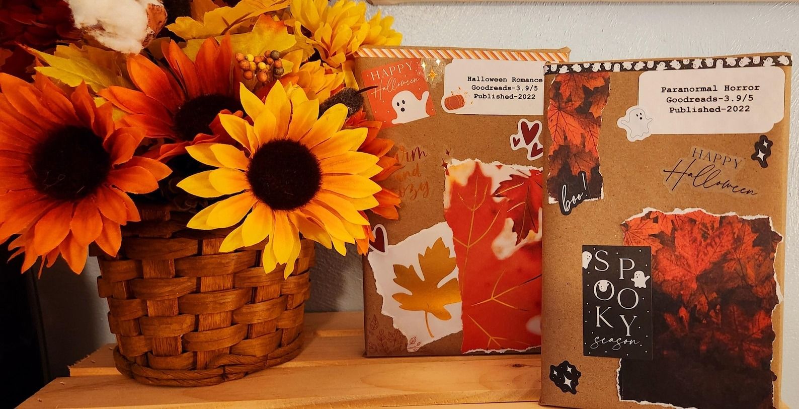 two books wrapped in brown paper with fall-themed stickers and text with the genre, Goodreads rating, and publication year
