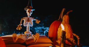 image of a skeleton sitting on a book