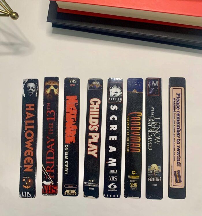 image of seven bookmarks made from the title spine of 90s horror VHS cases