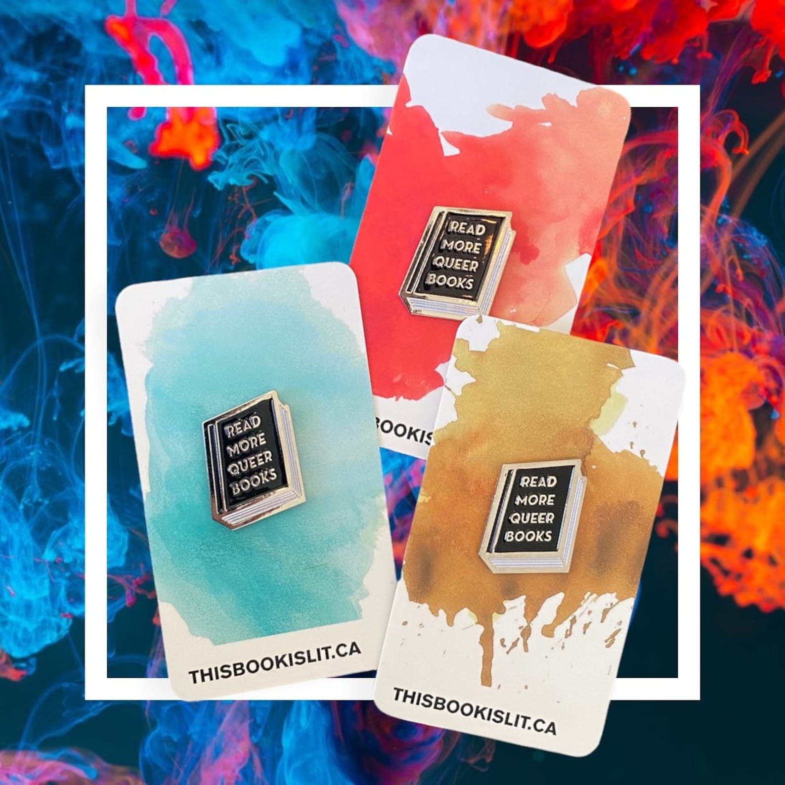 an enamel pin of a book that says Read More Queer Books