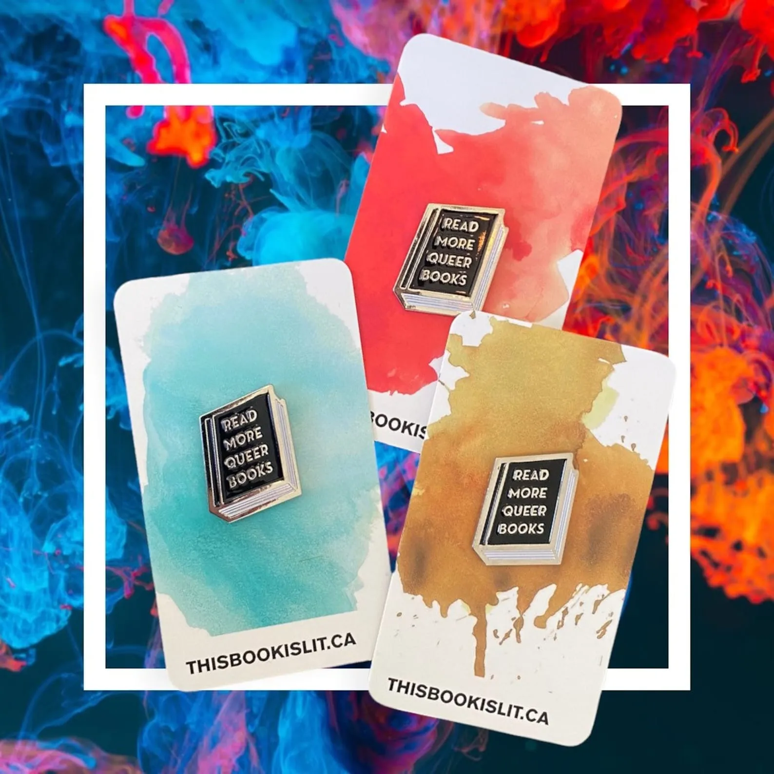 an enamel pin of a book that says Read More Queer Books