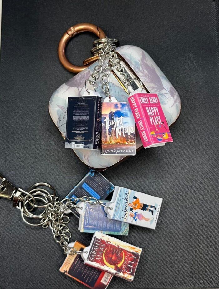 image of several mini versions of popular books connected to key rings