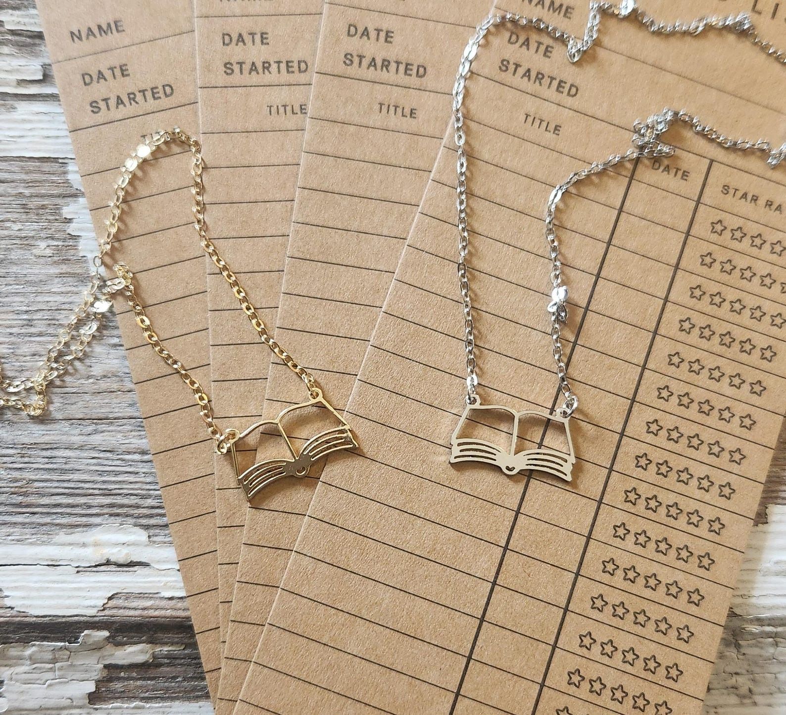 a necklace with the outline of an open book