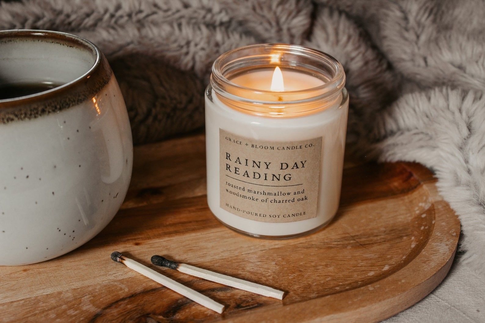a candle labelled "Rainy Day Reading"