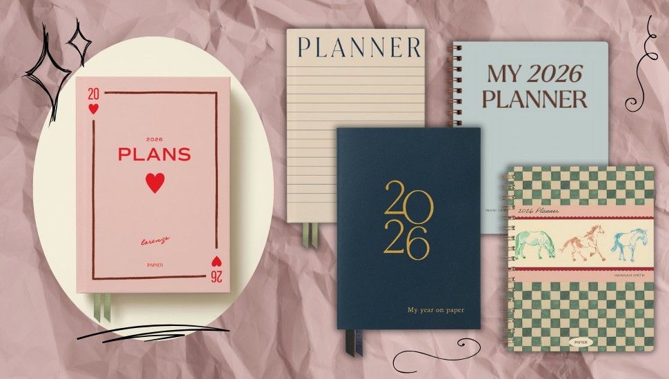 five Papier planners in assorted pastel pink and blue colors